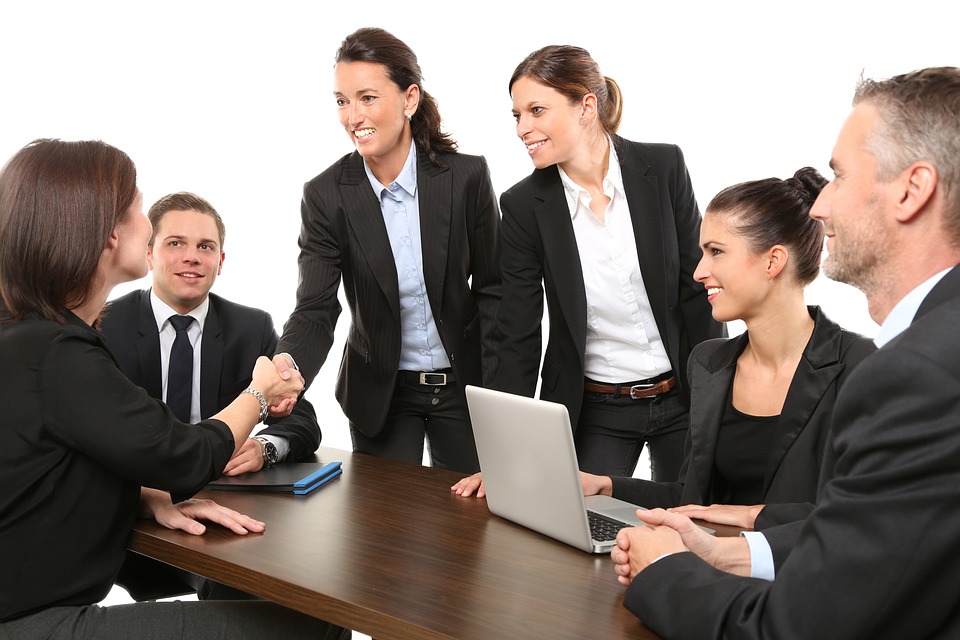 a group of people having a meeting